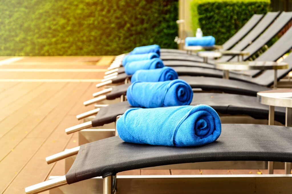 Towel on sun bed at poolside